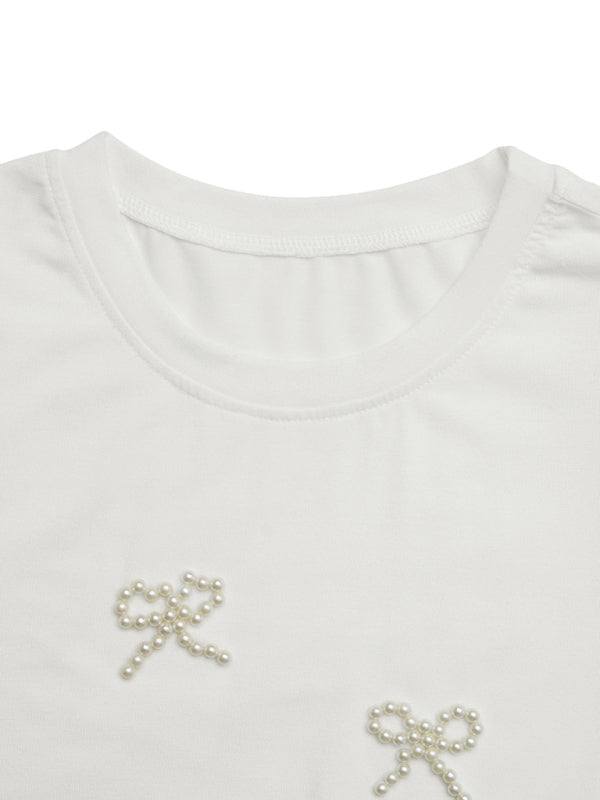 White T-shirt with pearl bow accents from Casual Bowknot Round Neck Pullover Beaded Puff Sleeve T-shirt