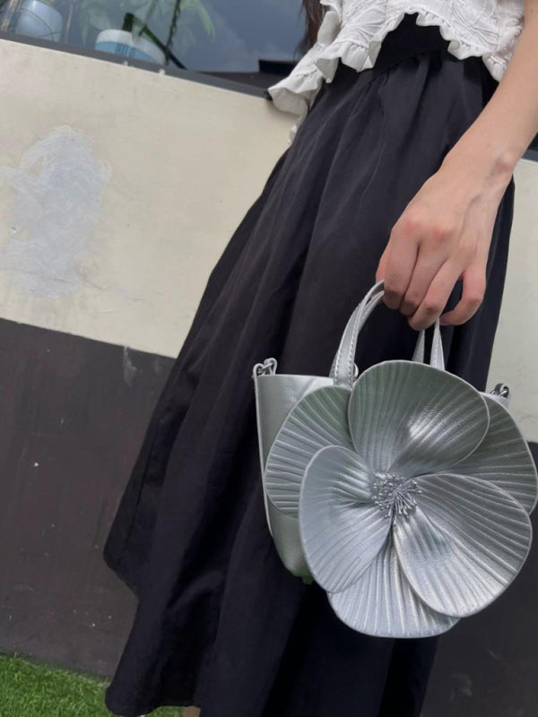 Silver flower-shaped handbag showcasing a versatile piece for stylish accessory collection