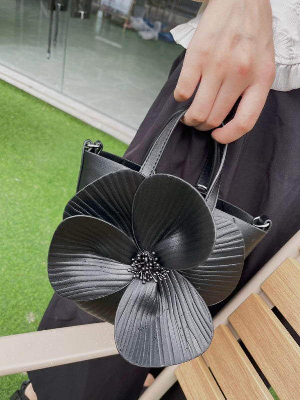 Black flower-adorned handbag from Creative Flower Handbag Shoulder Crossbody Chain Bag, a versatile piece