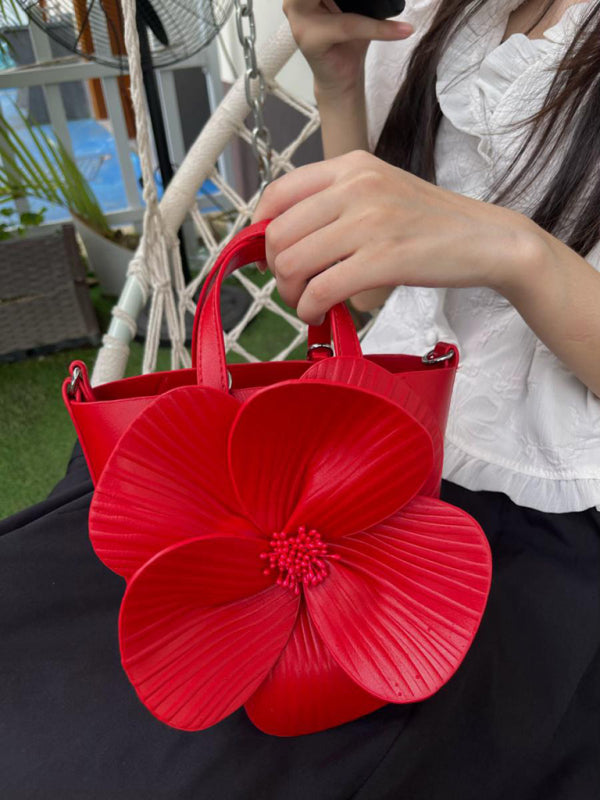 Red flower-adorned handbag, a versatile piece for stylish crossbody or shoulder wear