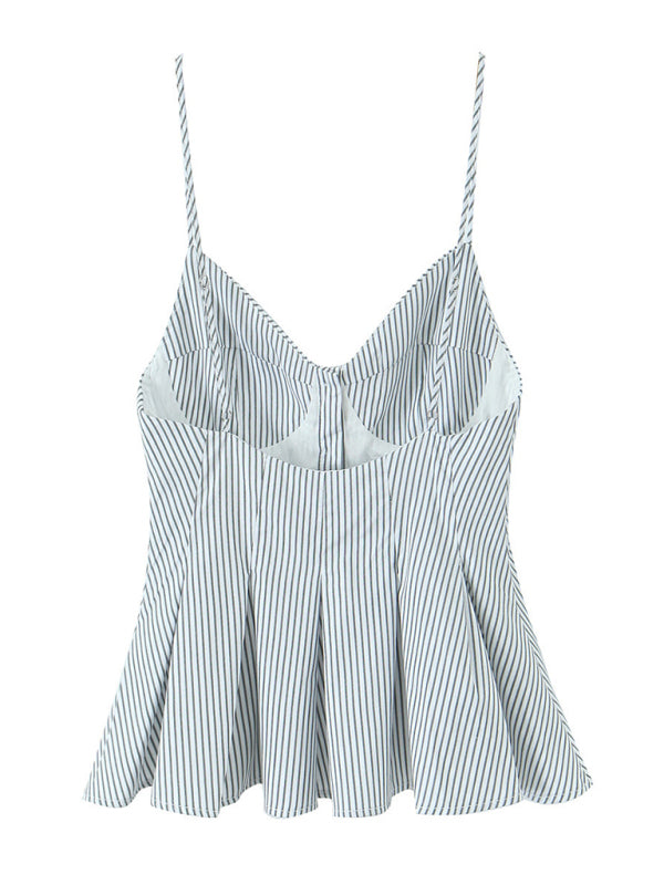 Elegant striped spaghetti strap top displayed in a fashionable women’s clothing store