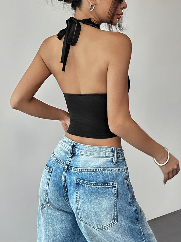 Back view of woman in Black Halter Top with slight elasticity and weaving type blue jeans