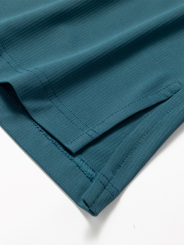 Teal textured fabric with side slit on Men’s sports outdoor fitness breathable stretch T-shirt