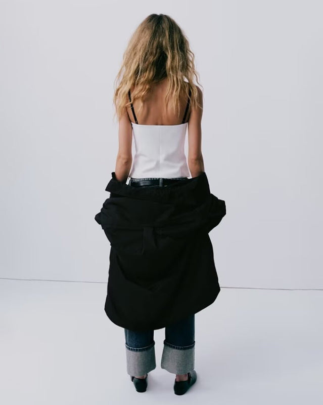 Woman in white tank top and jeans wearing New elegant and sexy lace patchwork bustier top