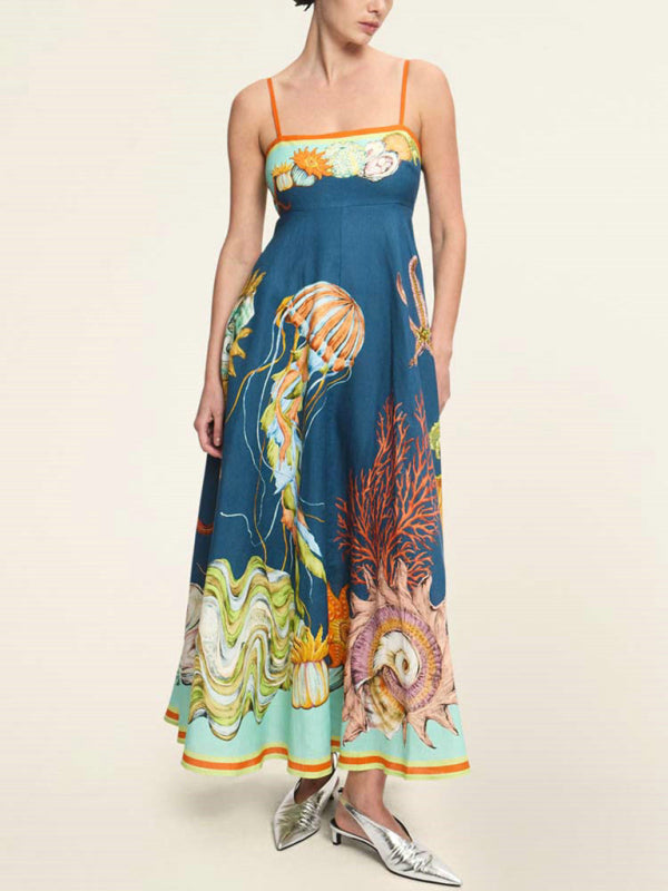 Blue sundress with ocean-themed body print, perfect for holiday style by the sea