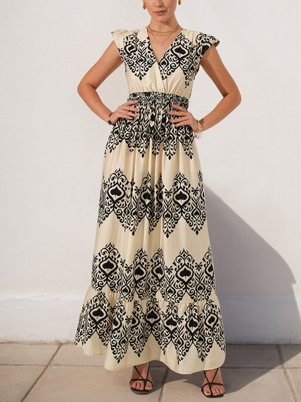 Cream and black patterned maxi dress with V-neck, high waist, and flowing sleeves