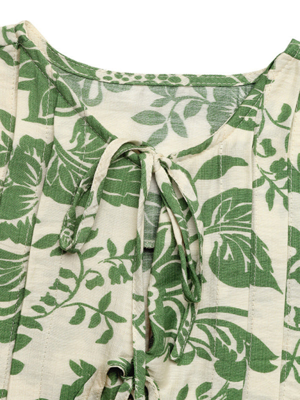 Green and white floral tie-front sleeveless shirt with pleats and lace-up detail