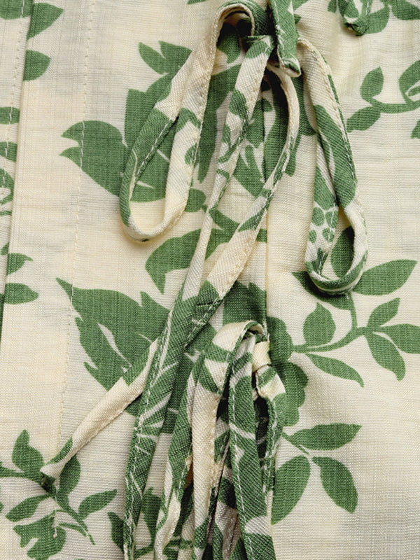 Floral patterned fabric with tie strings for Printed Pleated Lace-Up Sleeveless Shirt