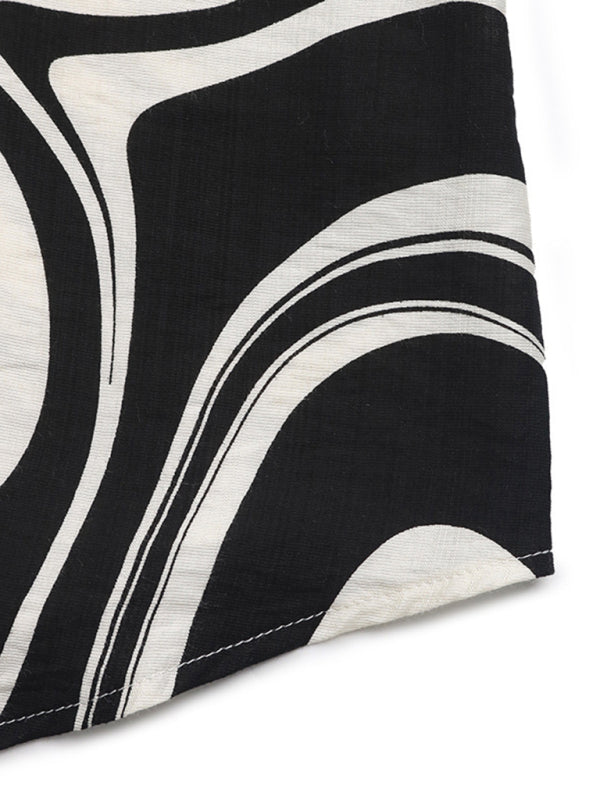 Black and white patterned fabric from the Ruffle Print Shirt Long Sleeve Dress collection