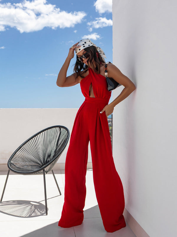 Woman wearing a red sleeveless off-shoulder halter neck waist jumpsuit