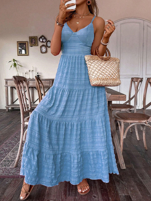 Light blue tiered maxi dress with suspender straps displayed in product listing