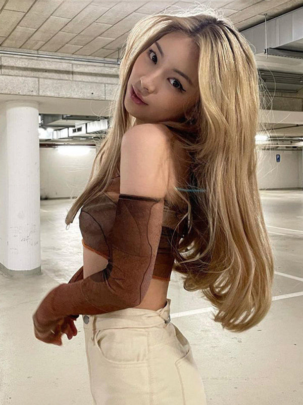 Blonde woman wearing brown top and cream pants in vintage abstract printed Spice Girls Short Top