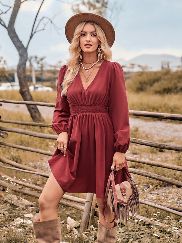Woman in a long-sleeved slim fit dress with stretch elastic waist and hat