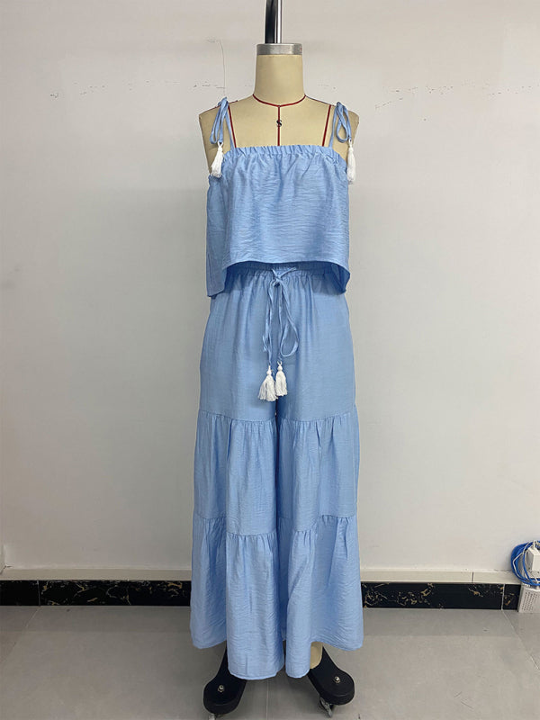 Light blue two-piece tassel outfit with suspender top and wide-leg trousers