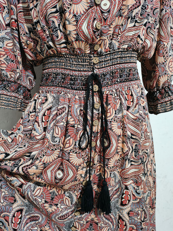 Patterned Bohemian casual holiday beach dress with three-quarter sleeves and tassel tie