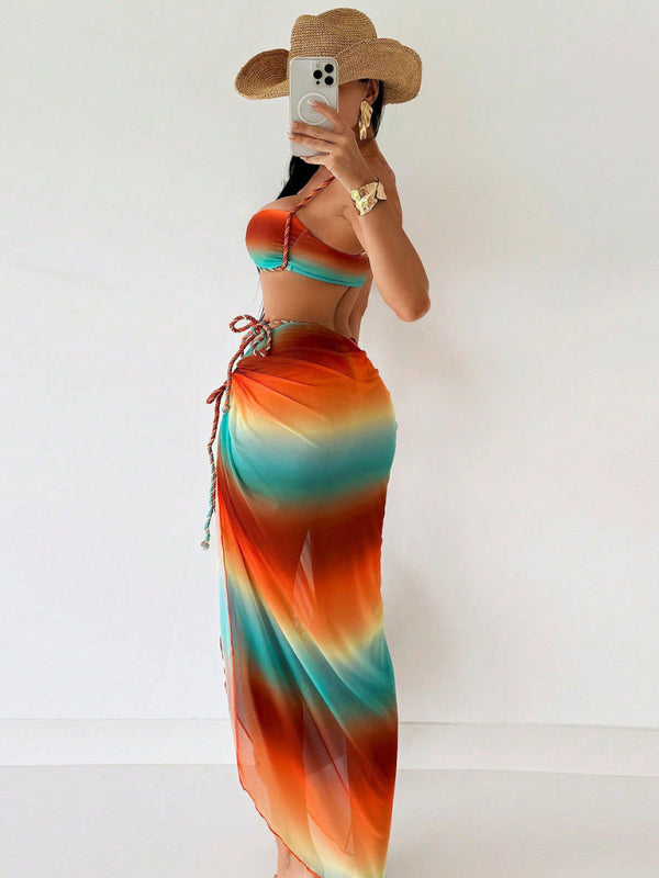 Woman in a colorful tie-dye braided floor-length bikini made of elastane spandex with high elasticity