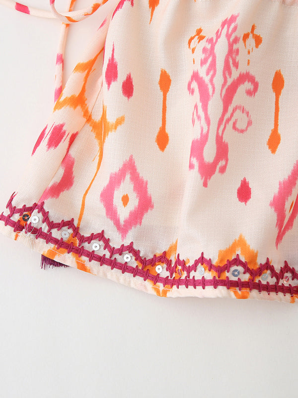 Patterned fabric with embellished sequin embroidery trim on V-neck camisole top
