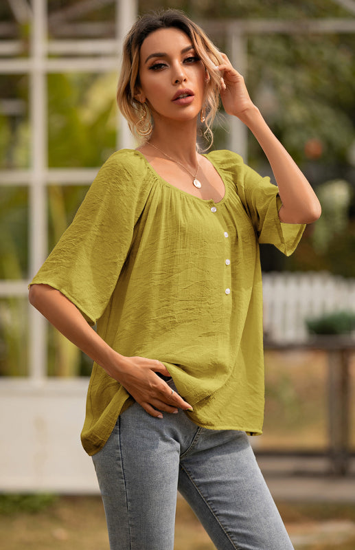 Woman wearing a green blouse with square neck and short sleeves, suitable for women