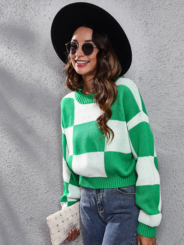 Women’s green and white checkerboard sweater with dropped shoulder sleeves, long acrylic sleeves