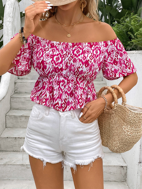 Woman wearing a pink and white patterned off-the-shoulder short sleeve shirt with white shorts