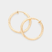 Women's 1.25 Inch Textured Metal Hoop Clip On Earrings