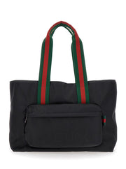 Gucci Men Black Tote Bag With Web Handles And Logo Lettering On The Front In Tech Fabric Man