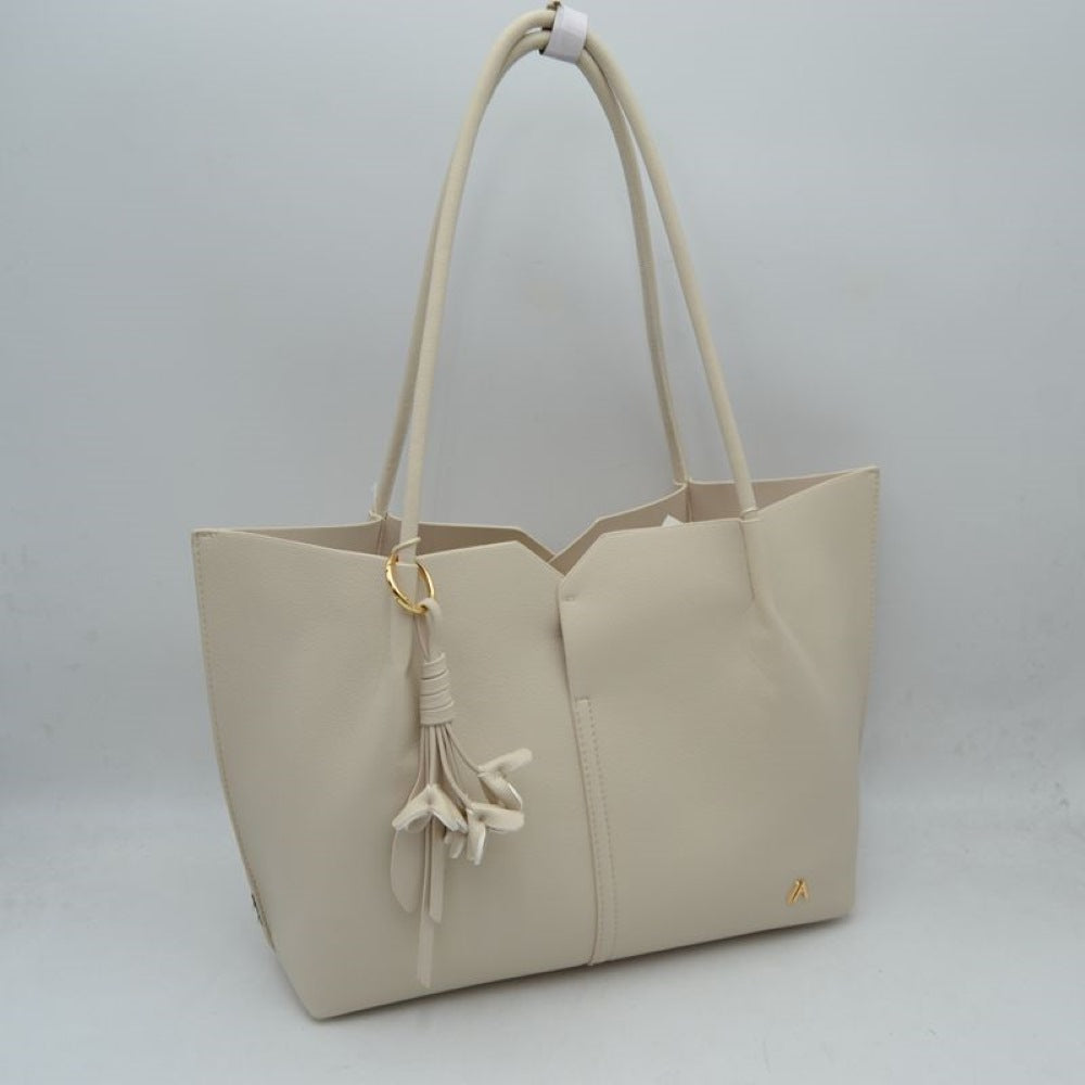 Minimalist Structured Tote Bag with Geometric Cutout and Tassel Accent