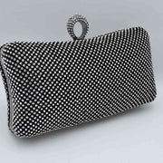 Shimmering Studded Clutch Bag with Textured O-Ring Clasp