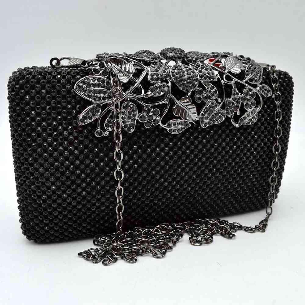 Studded Evening Clutch with Ornate Leaf Clasp Detail