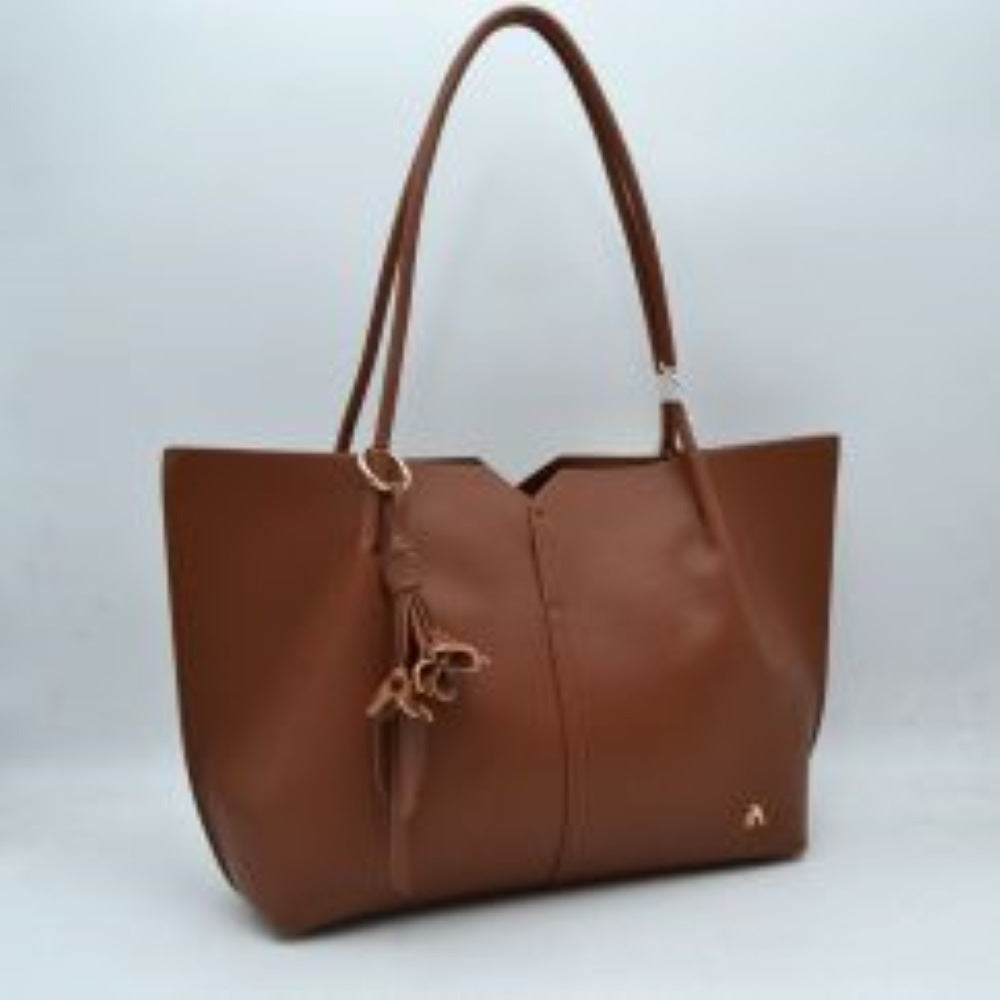 Minimalist Structured Tote Bag with Geometric Cutout and Tassel Accent
