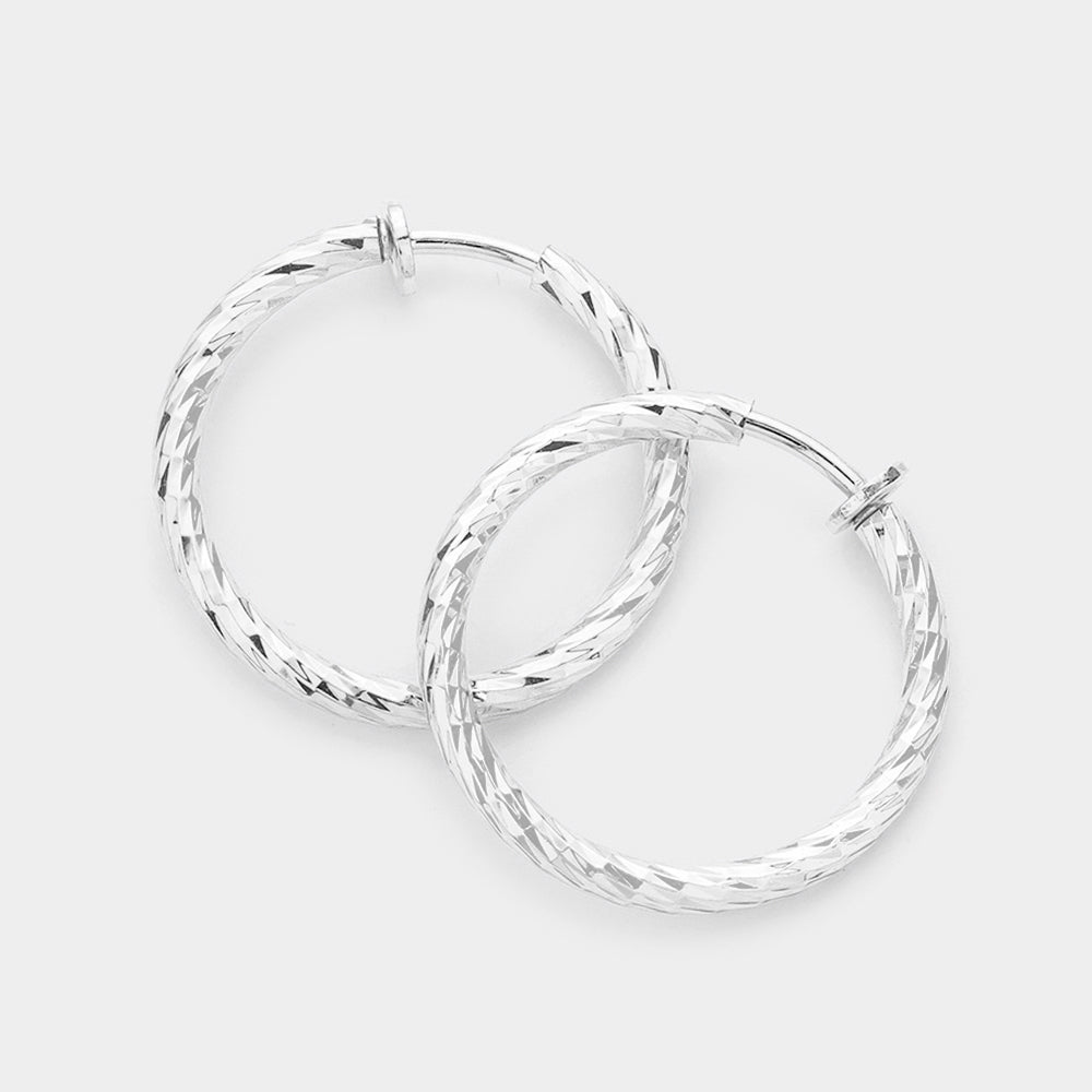 1.25" Textured metal hoop clip on earrings
