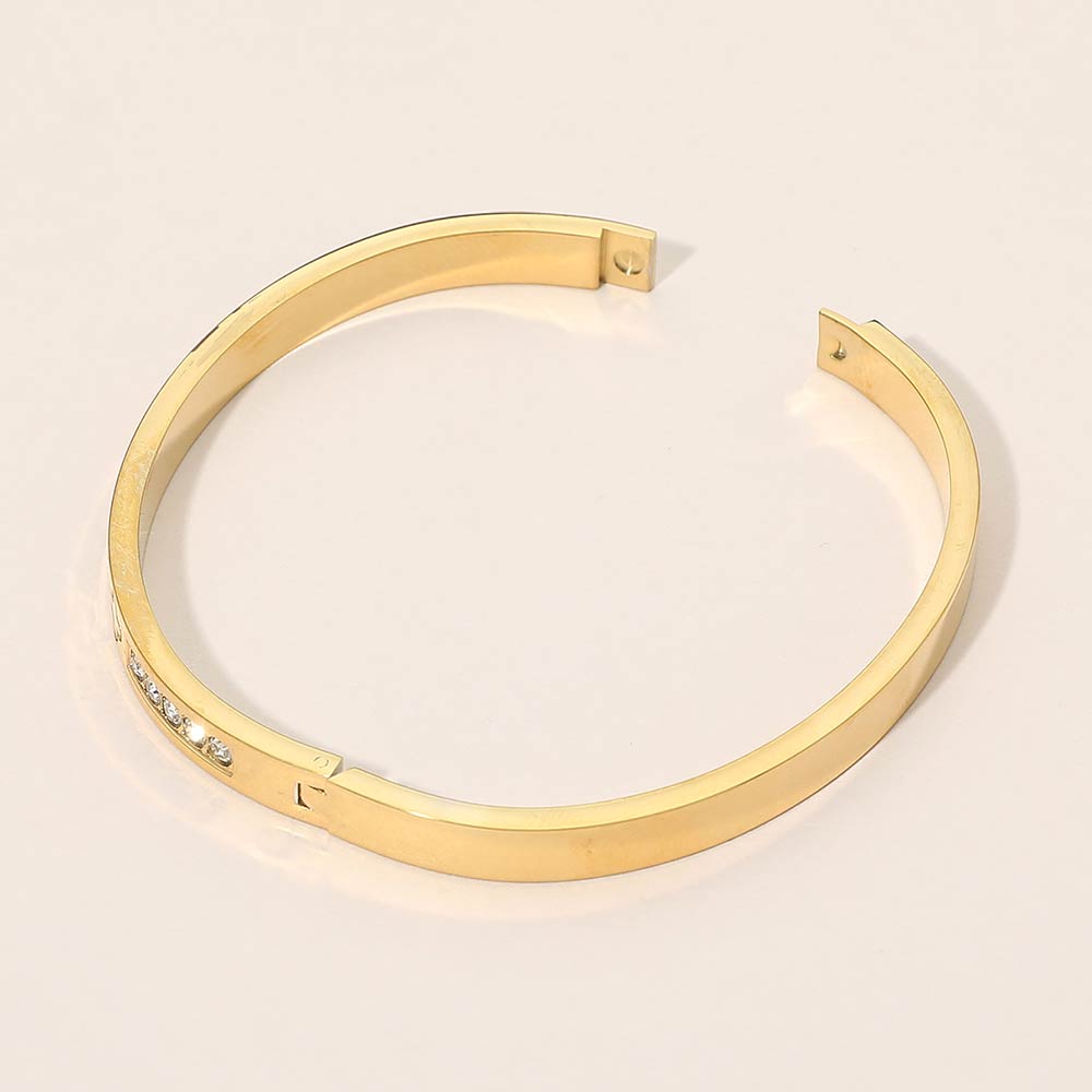 Stainless Steel CZ Accent Quatrefoil Engraved Hinged Bangle Bracelet