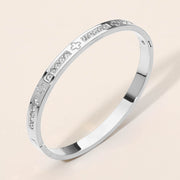 Stainless Steel CZ Accent Quatrefoil Engraved Hinged Bangle Bracelet
