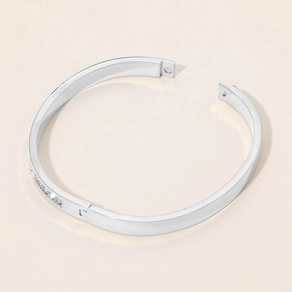 Stainless Steel CZ Accent Quatrefoil Engraved Hinged Bangle Bracelet