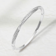 Rhodium Plated CZ Pave Twist Hinged Bangle Bracelet