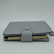 Compact Pebbled Everyday Wallet with Snap and Zipper Closure