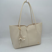 Minimalist Structured Tote Bag with Geometric Cutout and Tassel Accent