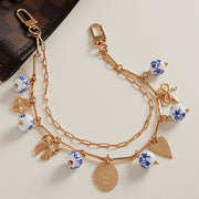 Floral Ceramic Ball Metal Bow Heart Quatrefoil Charm Station Layered Chain Bag Charm