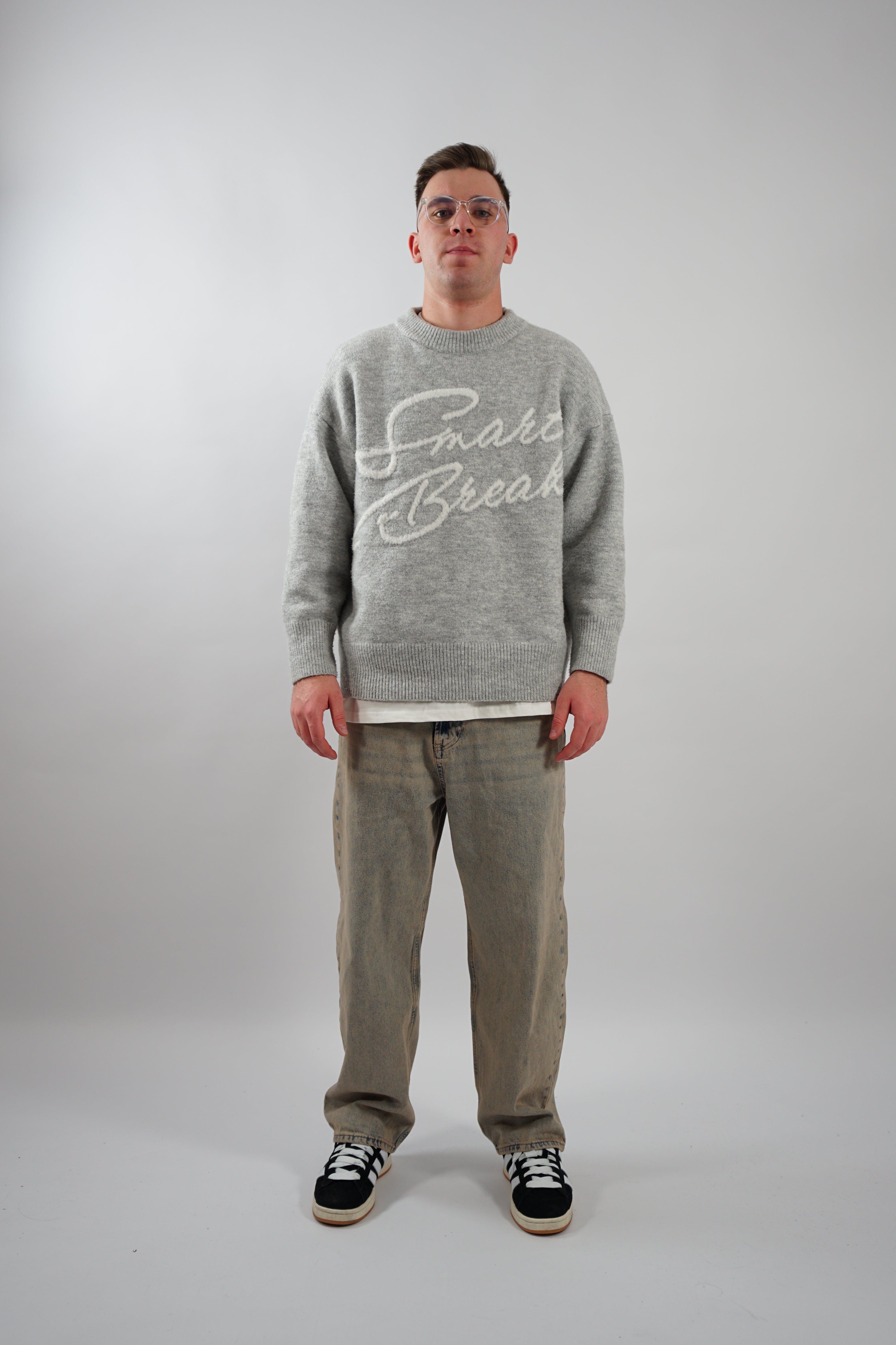 BLACK KNIT SWEATER WITH SMART BREAK TEXT - BREAK KNIT STYLE