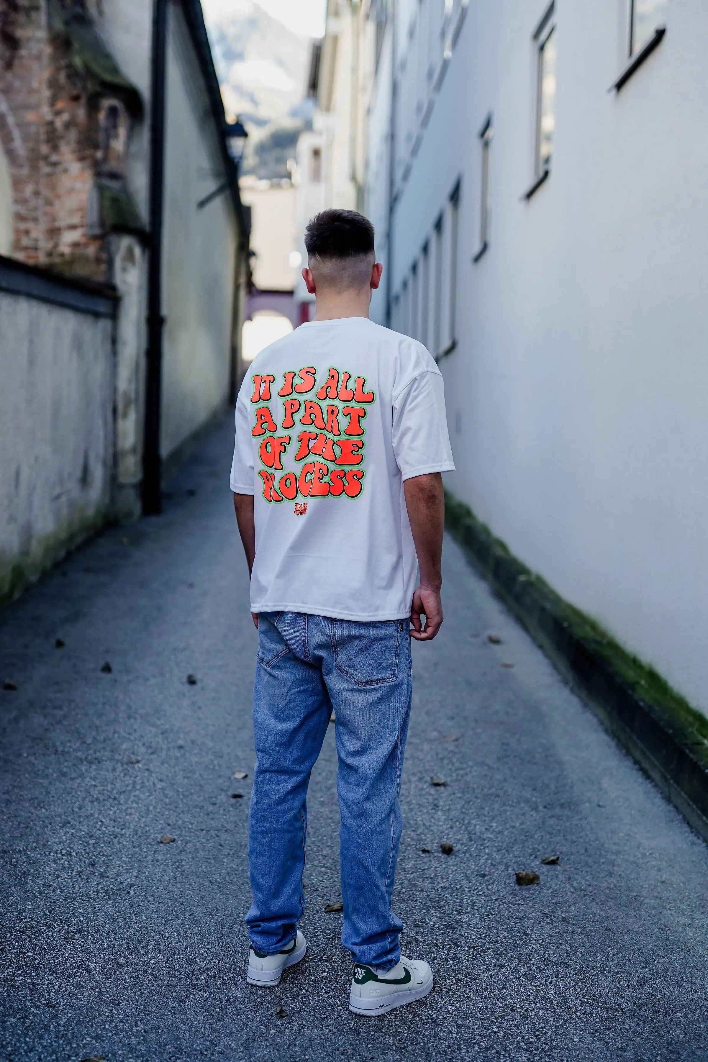 BLACK OVERSIZE SHIRT WITH PINK AND GREEN TEXT FOR ULTIMATE COMFORT