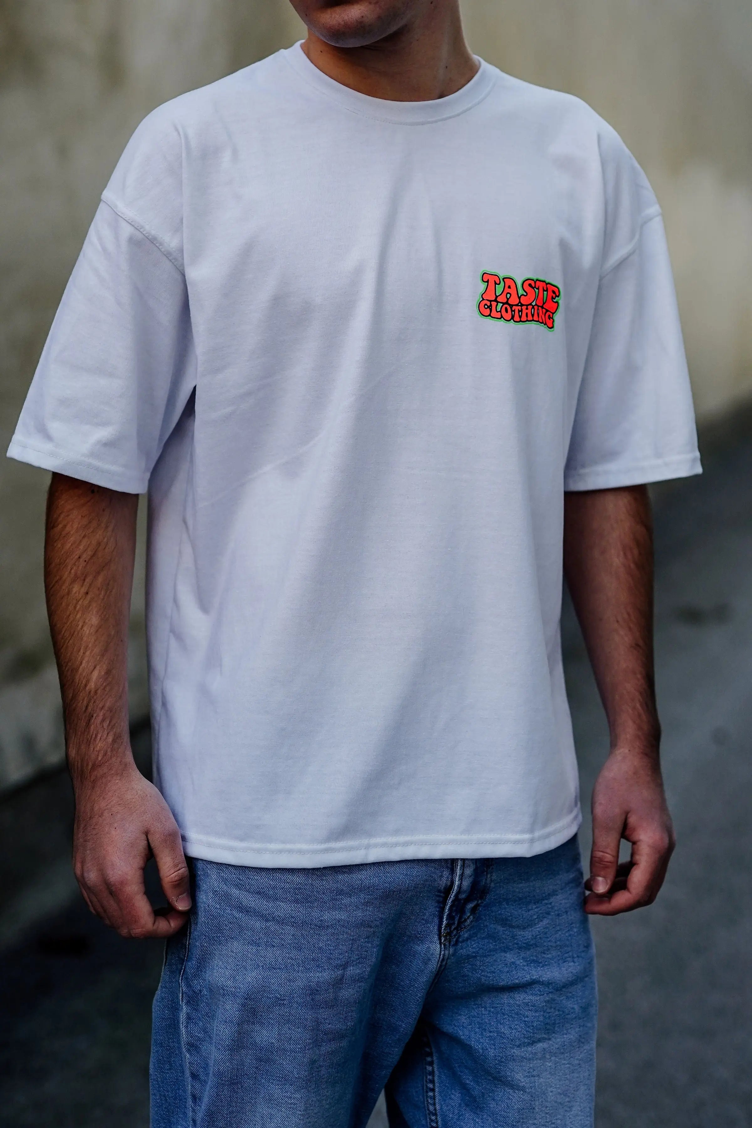 BLACK OVERSIZE SHIRT WITH PINK AND GREEN TEXT FOR ULTIMATE COMFORT