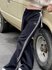 BLACK RETRO SWEATPANTS WITH WHITE STRIPES - RETRO SWEATPANTS