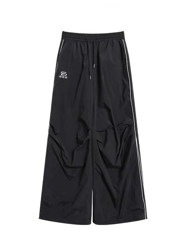 BLACK WIDE-LEGGED TRACK PANTS WITH DRAWSTRING WAIST AND LOOSE FIT