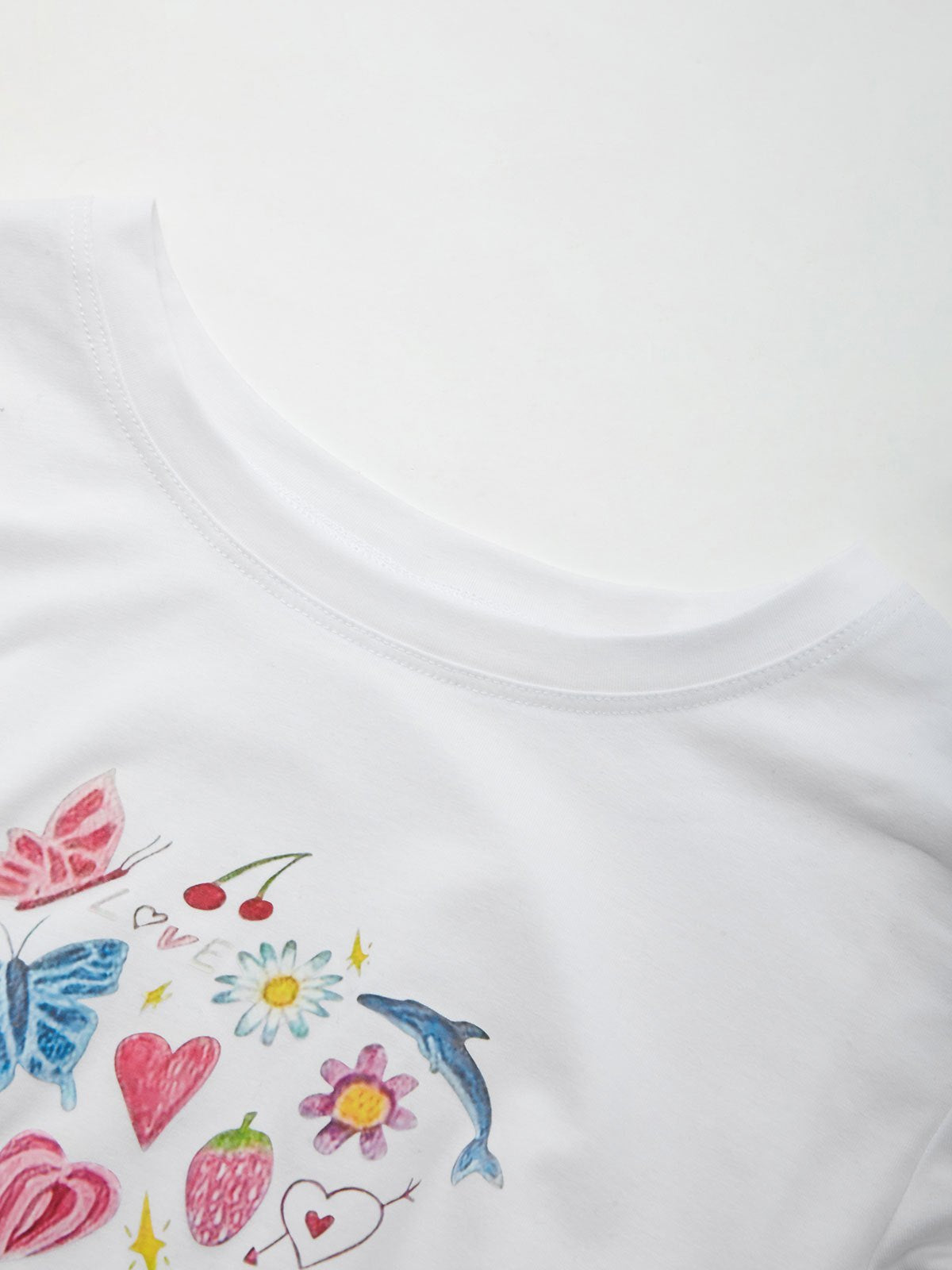 COLORFUL DOODLE CROP TOP WITH ROUND NECK AND SLIM FIT IN COTTON BLEND