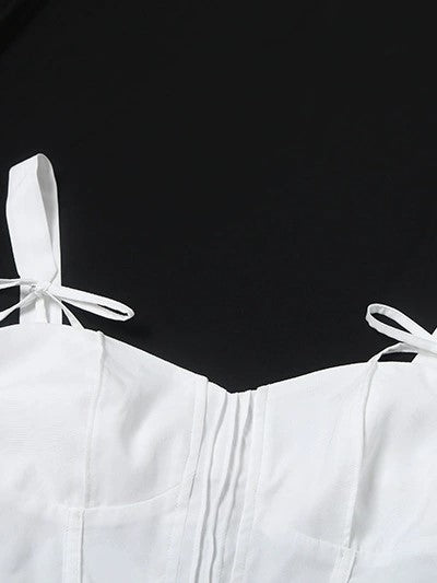 CORSET-STYLE TOP WITH TIE STRAPS AND BOW TIE CAMI DETAIL