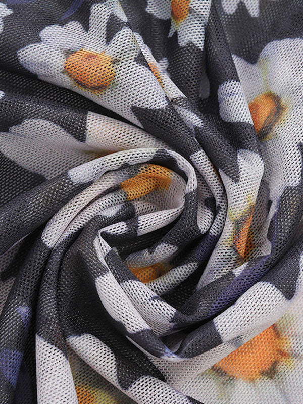 DAISY-PATTERNED MAXI DRESS WITH SLIM FIT AND ROUND NECK