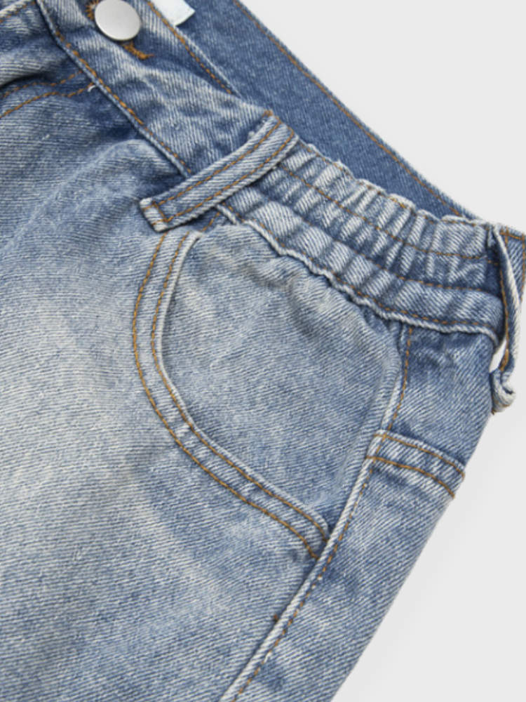 DISTRESSED LIGHT BLUE JEANS WITH SIZE CHART FOR EXPERT FIT GUIDANCE