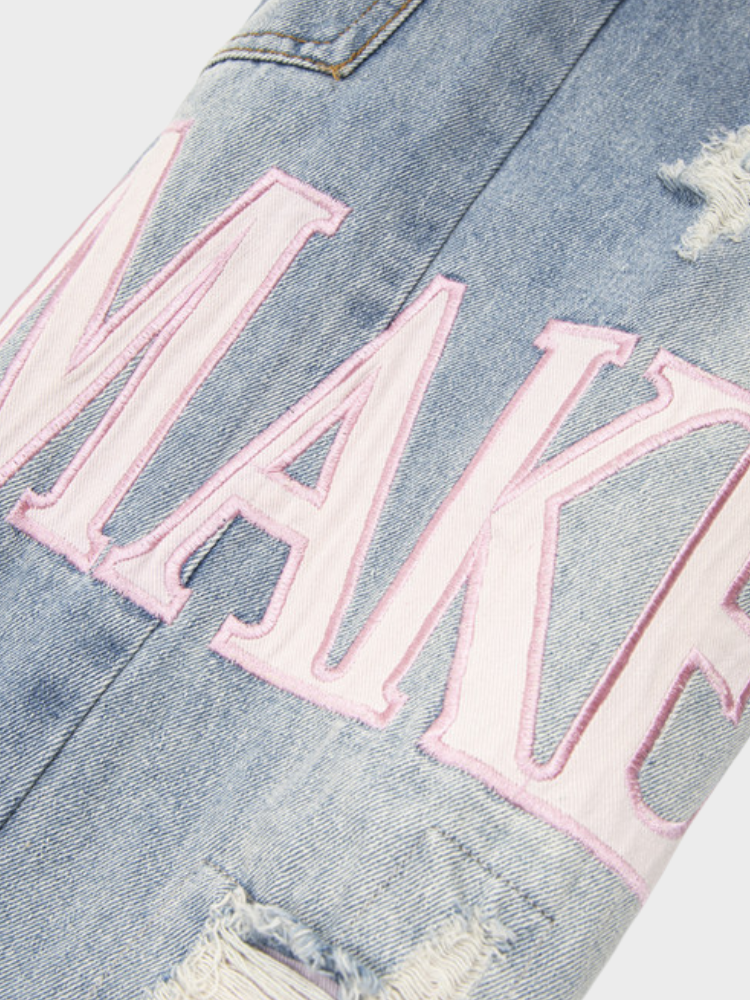 DISTRESSED LIGHT BLUE JEANS WITH SIZE CHART FOR EXPERT FIT GUIDANCE