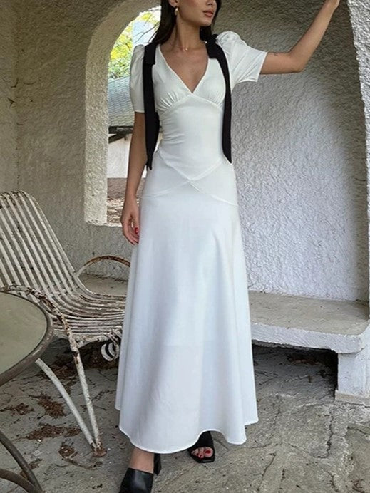 ELEGANT WHITE DRESS WITH BLACK RIBBON ACCENTS AND ROMANTIC PUFF SLEEVES