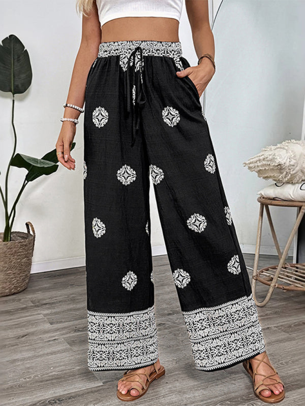 Black and white patterned palazzo pants with elastic waist and drawstring for casual wear